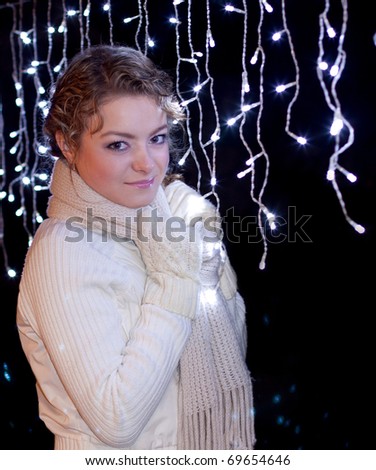 Pretty young woman with fire-lights