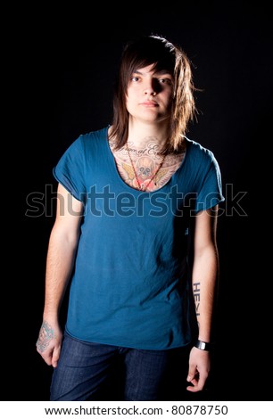 Young man with tattoos posing