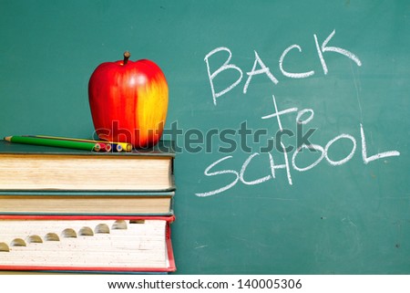 Back to School chalkboard and apple on books