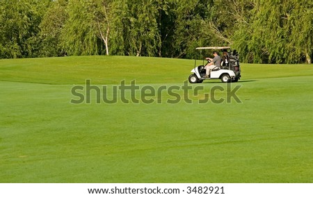 Golf course action and players hitting the greens