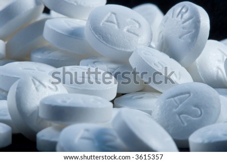 A pile of spilled medical pills from a bathroom cabinet