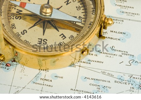 Antique compass used by explorers for finding directions and reading a map or chart