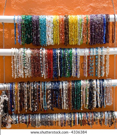 Bright and colorful mexican bracelets and jewelry for sale at the bazaar or marketplace by vendors