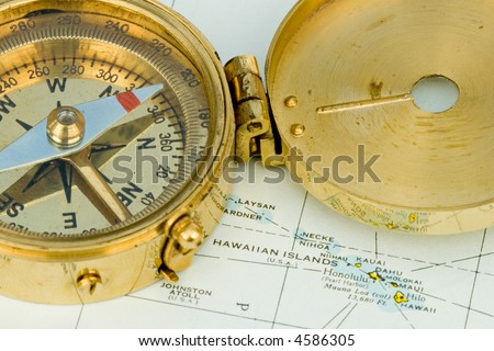 Antique compass used by explorers for finding directions and reading a map or chart