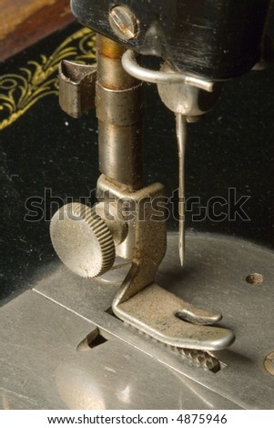 Antique sewing machine needle and base with rust and pitted metal