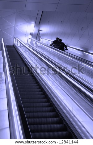 Escalator in the airport terminal to the next level