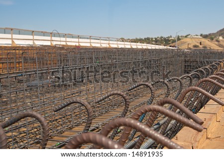 Highway bridge construction project showing rebar and wood framing