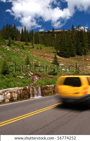 Summer vacation travelers tour through Rocky Mountain National Park in Colorado USA