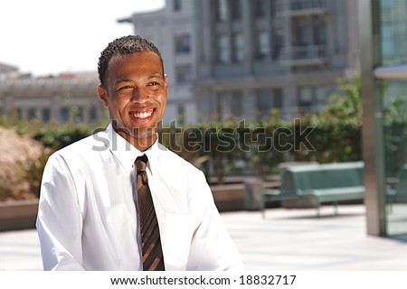 An confident and successful African-American businessman in a power suit
