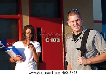 Young college students outside of a classroom at a public university