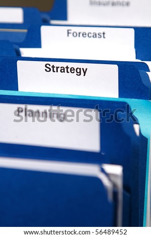 Filing cabinet full of business folders and documents