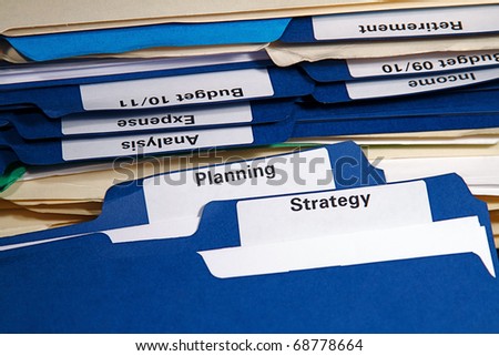 Filing cabinet full of business folders and documents