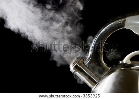 Tea kettle with boiling water; steam against a black background.