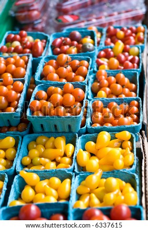 Colorful Cherry tomatoes for sale at the Pike Place Market in Seattle, Washington. Short depth of field.