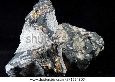 some gold, copper and iron pyrite samples lodged in granite and quartz