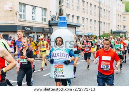 LONDON - APRIL 26: Group of unidentified men run in the Virgin Money London Marathon on April 26, 2015 in Isle of Dogs, London, England, UK.