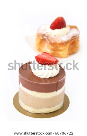 puff pastry with strawberry and chocolate cappuccino layer cake isolated on white background