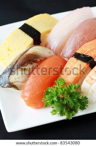 sushi of raw fish, grilled fish, egg and crab stick