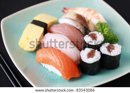 sushi of raw fish, grilled fish, egg and shrimp