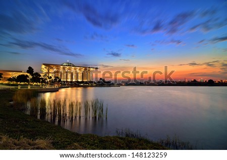 Famous Mosque with beautiful light and reflection capture at sunset and calm water.