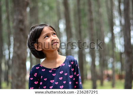 Young girl posing in nature forest park