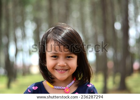 Cute girl  smile in nature forest park