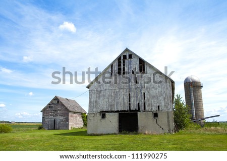 Traditional american Farm With Cloudy Sky