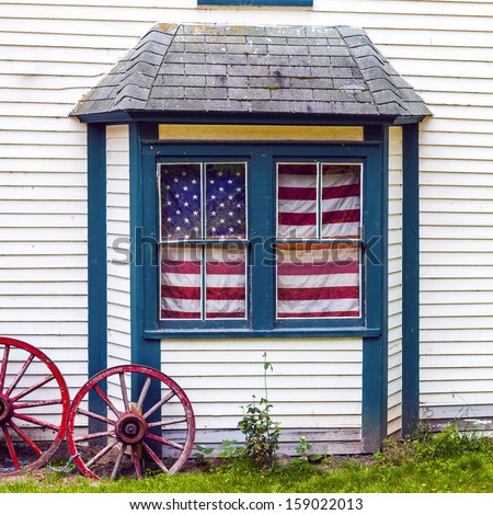 Old House With American Flag In Window