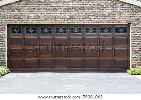 Dark Wooden Garage Door with brick wall background
