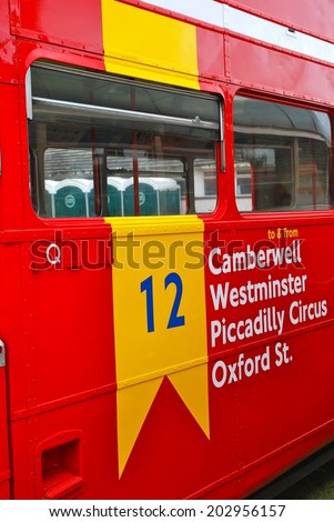 LONDON - AUGUST 10: Routemaster Bus operating in London on August 10, 2011 in London, UK. The open platform facilitated speedy boarding under the supervision of a conductor.