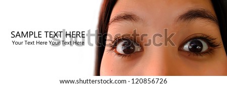 Close up of young asian woman eyes feel excited with sample text on white background