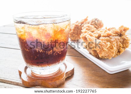 Iced cola drink and fried chicken, stock photo