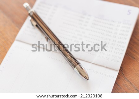Bank account passbook with pen, stock photo