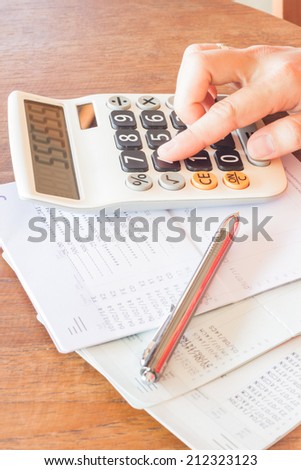 Businesswoman checking account balance, stock photo