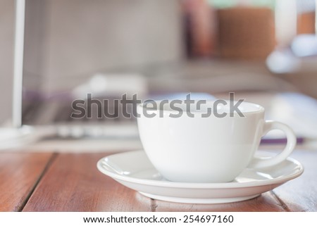 White coffee cup on work station, stock photo