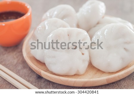 Chinese leek steamed dessert on wooden table, stock photo