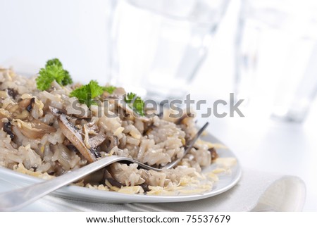 Mushroom risotto with parsley, italian cuisine.