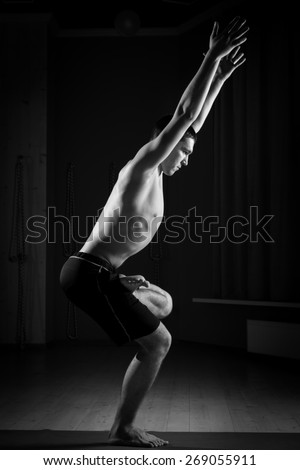 young man doing yoga , black and white