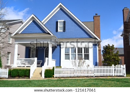 Blue and White Suburban American Cape Cod Home with Front Porch