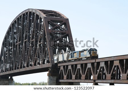 LOUISVILLE, KY - NOVEMBER 10: A Canadian National train crosses over a steel truss bridge over the Ohio River on November 10, 2012 in Louisville, Kentucky.