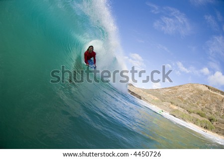 bodyboarder deep in the tube of a giant wave (for editorial use only)