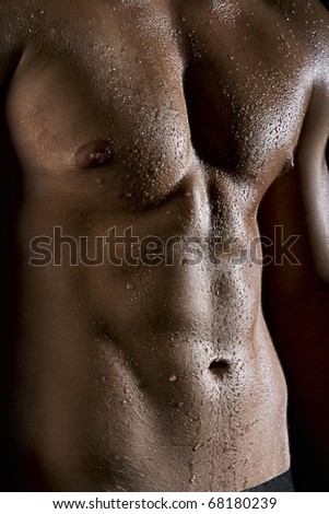 Muscle man torso with drops a water