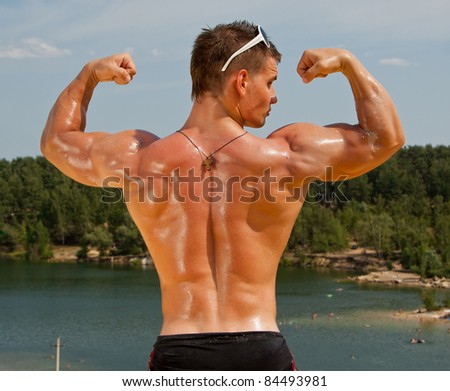 Muscle sexy wet young man back and biceps