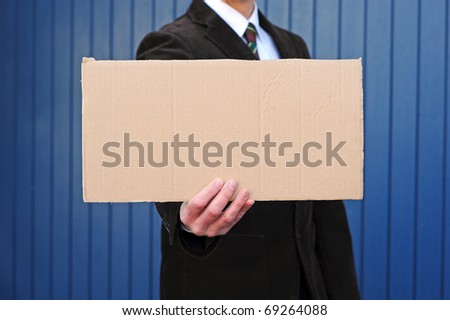 Man with empty cardboard-sign
