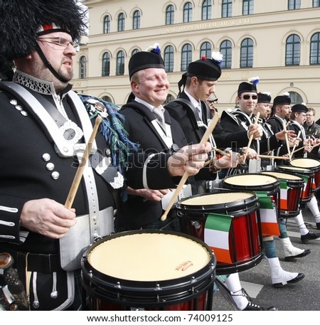 MUNICH - MARCH 13: irish drummers marches at the St. Patrick\'s day on March 13, 2011 in Munich, Germany. This national irish holiday takes place annually in March in Dublin and other european cities.