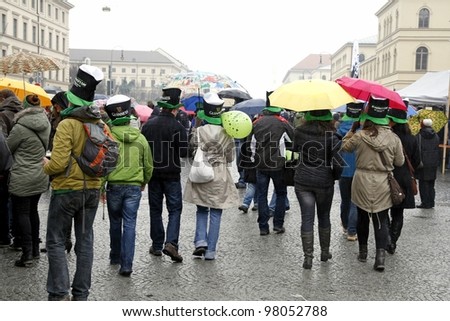 MUNICH - MARCH 11:people in irish hats celebrates St. Patrick\'s day on March 11, 2012 in Munich, Germany. This national Irish holiday takes place annually in March in Dublin and other European cities.