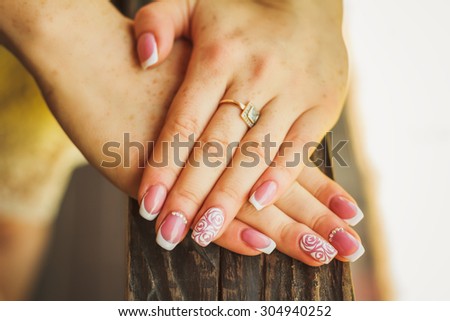 Close-up wedding nail art with roses