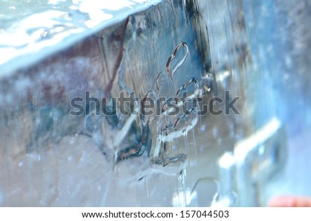 Human hand print on huge ice block.