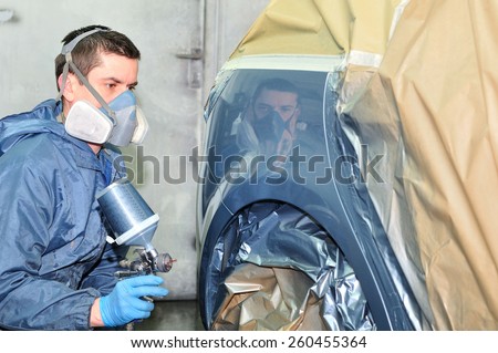 Professional car body repair, Painting side panel.