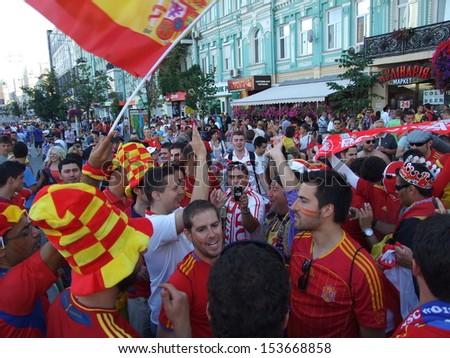 KIEV, UKRAINE Ã¢Â?Â? 01 JULY 2012: Unknown football fans of Poland national team make a songÃ¢Â?Â?s competition with fans of Italy national team on Euro-2012 on July 01, 2012 in Kiev, Ukraine.